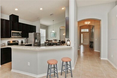 SIT AT THE BAR WHILE YOUR HUSBAND PREPARES DINNER!