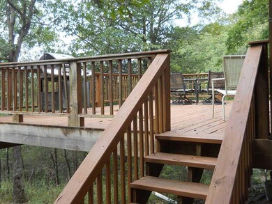 Patio/Deck. Easy off ! Just down a few steps to ground level and down the slope to the river.