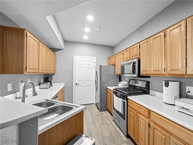 Kitchen featuring stainless steel appliances, ligh