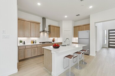 Kitchen in the Da Vinci II home plan by Trophy Signature Homes – REPRESENTATIVE PHOTO