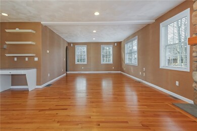 Large front to back living room with fireplace