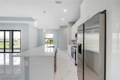 Kitchen with stainless steel appliances, modern ca