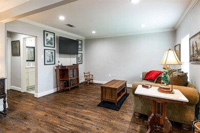 Living room with gorgeous hand scraped hardwoods.