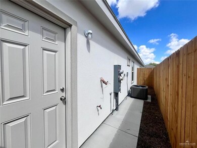 View of side of home with a cooling unit and stucco siding