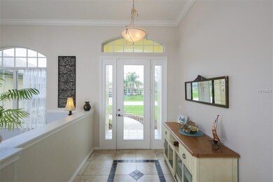 This etched glass door with dueling sidelites and 
