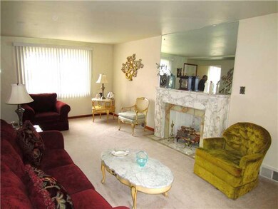 Living Room. It features large windows, neutral to