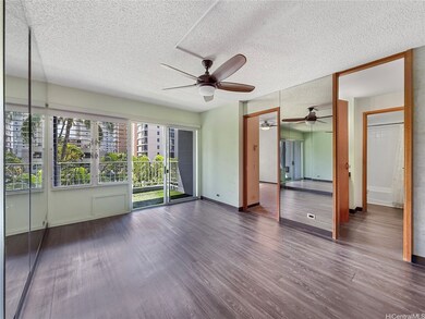 Spacious living room and open kitchen with island.