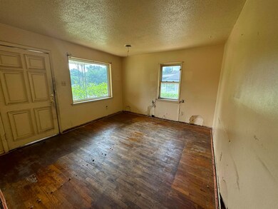 Empty room featuring a wealth of natural light, a 