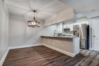 Chef's kitchen with counter for seating and separa