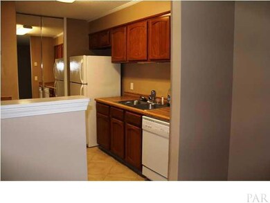 The well equipped kitchen contains a smooth top electric range