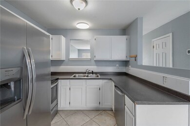 Kitchen featuring stainless steel appliances, a si