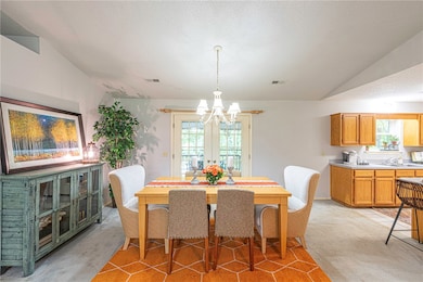 Formal dining space connecting to living room, kit