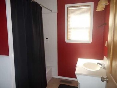 Bathroom. Bath has full bath with ceramic tile flo