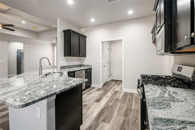 Kitchen featuring appliances with stainless steel