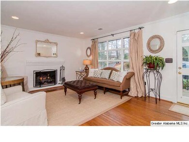 Formal living room has beautiful hardwood floors a