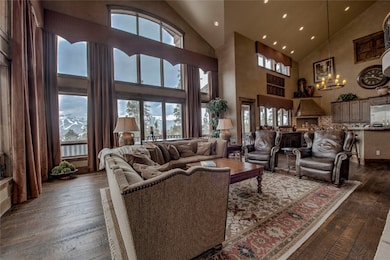 Living room featuring dark wood-style floors, a no