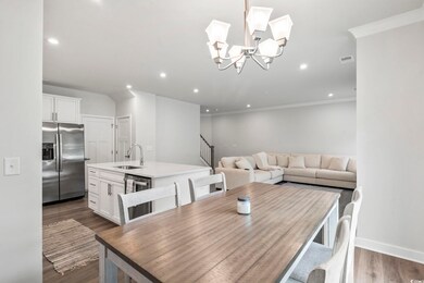 Dining room with dark hardwood / wood-style floors