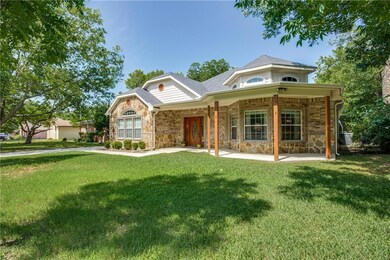 Beautiful rock and brick exterior. Wrap around fro