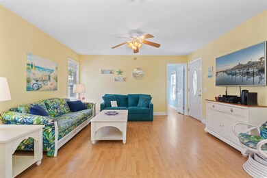 Living room featuring light wood-style flooring, b
