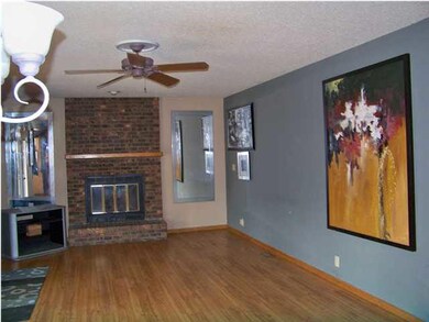 Main floor family room has woodburning fireplace.