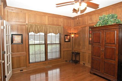 At the front of the home, the private den features