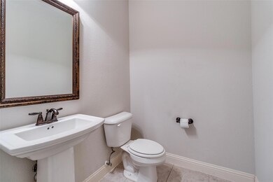 Half bath just around the corner from the study an