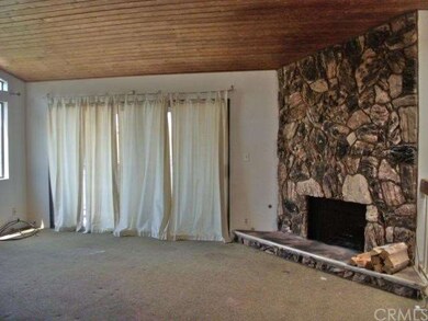 Corner fireplace in great room and windows to larg