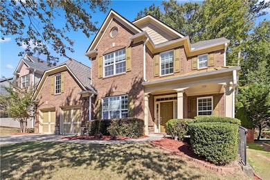 Traditional-style home featuring a front lawn, dri