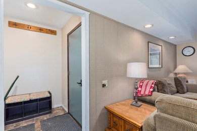 Living area featuring recessed lighting and baseboards