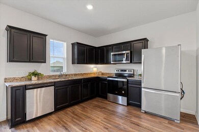 Kitchen with stainless steel appliances, light st