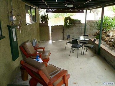side covered patio faces Garage