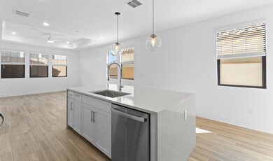 Kitchen with sleek pendant lighting
