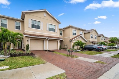 View of front of property with driveway, stucco si