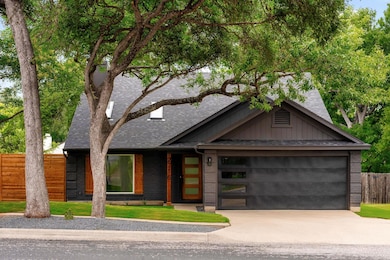 View of front of house featuring concrete drivewa
