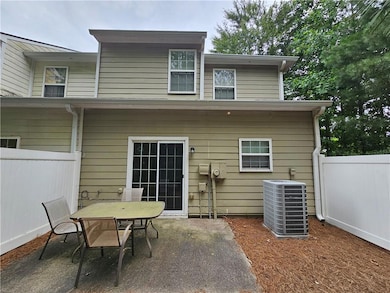 Back of property with a patio area and outdoor dining space