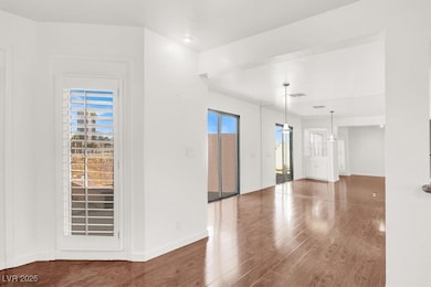 Spare room featuring wood finished floors and baseboards
