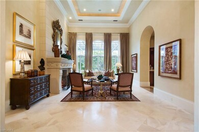Marble Floor Living Room Flanked by Stone Fireplac