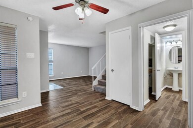 View from DR into downstairs 1/2 bath & laundry ar