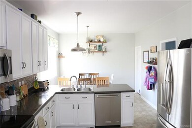 Kitchen with white cabinets and stainless steel ap