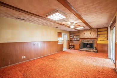 Unfurnished living room with carpet, ceiling fan, 