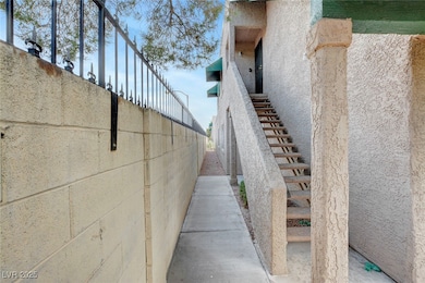 View of property exterior featuring stairs and stu