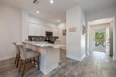 Kitchen featuring a kitchen breakfast bar, wood fi