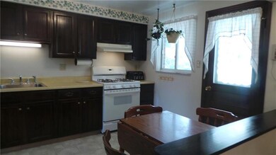 Eat-in kitchen has access to the back porch and pa