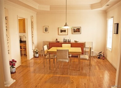 Formal dining room accented with tray ceiling and