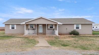 Ranch-style house featuring covered porch and a shingled roof