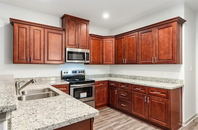 Modern kitchen featuring elegant granite counterto