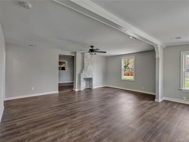 The front living room is huge with new paint throu