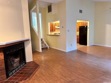 Unfurnished living room with light wood-type floo