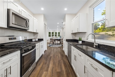 Beautiful kitchen with granite counters, stainless