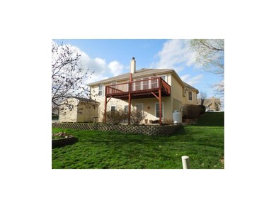 Landscaped flower beds and a wooden storage shed